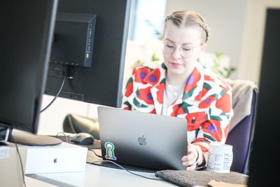 A picture of a woman working at her computer