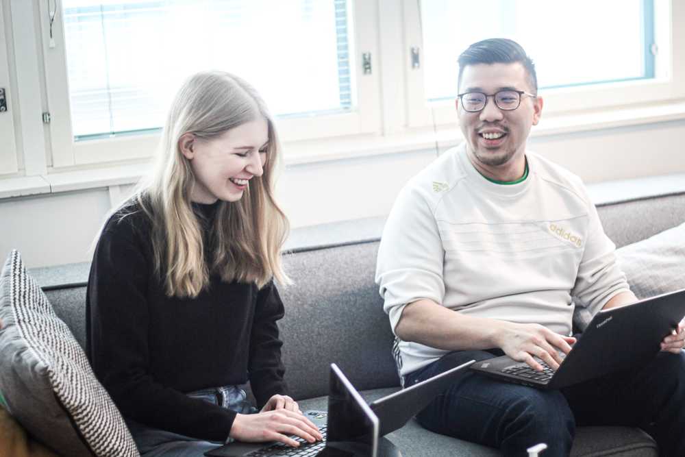 A man and woman smiling